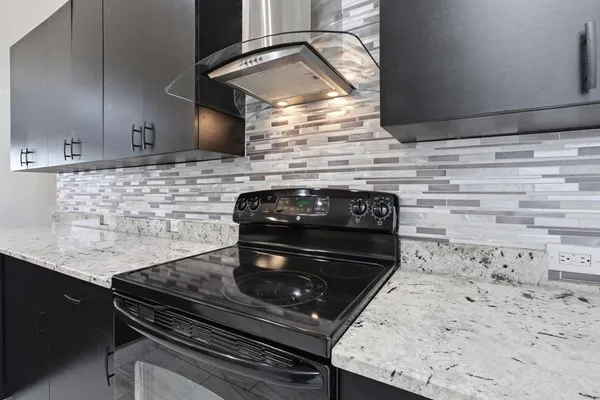a kitchen with a stove and a sink