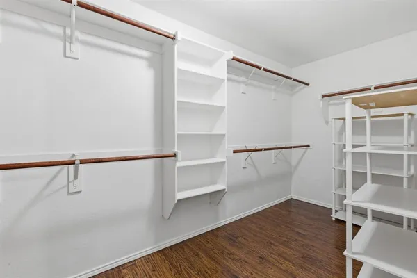a view of an empty walk in closet