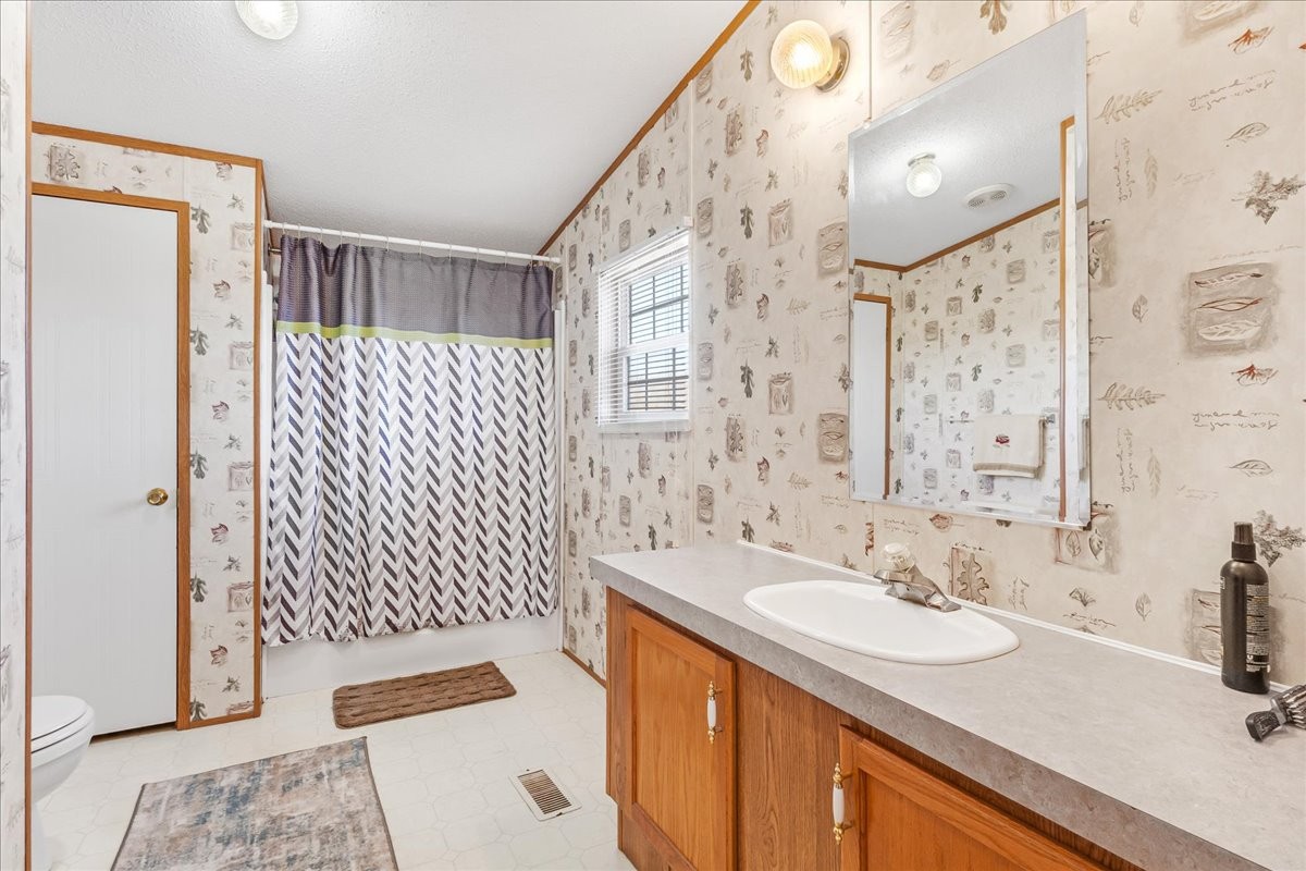 1175 Caney Branch Road Morrison, TN 37357 - Photo 27 of 52 a bathroom with a sink and a mirror