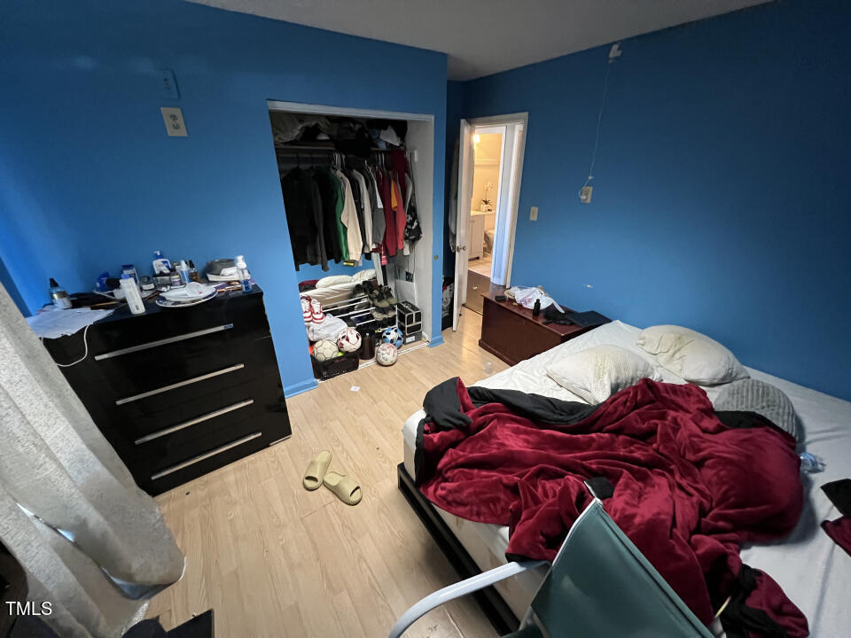 8300 Wynewood Court Raleigh, NC 27616 - Photo 20 of 51 a bed sitting in a bedroom next to a window