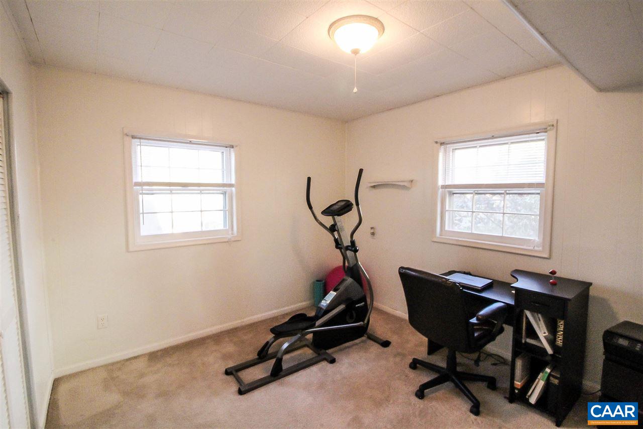 726 Shamrock Road Charlottesville, VA 22903 - Photo 15 of 27 a view of a workspace with furniture and a window