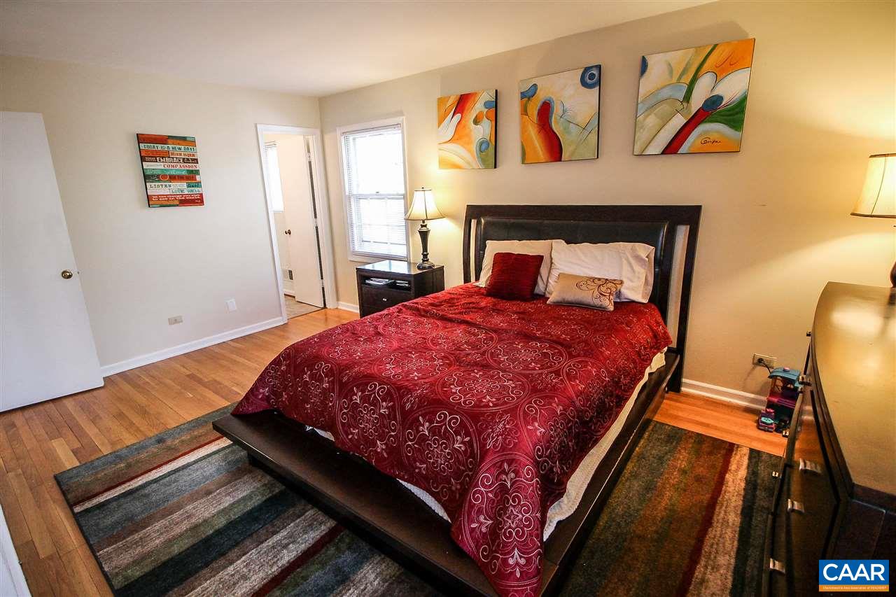 726 Shamrock Road Charlottesville, VA 22903 - Photo 22 of 27 a bed sitting in a bedroom next to a window