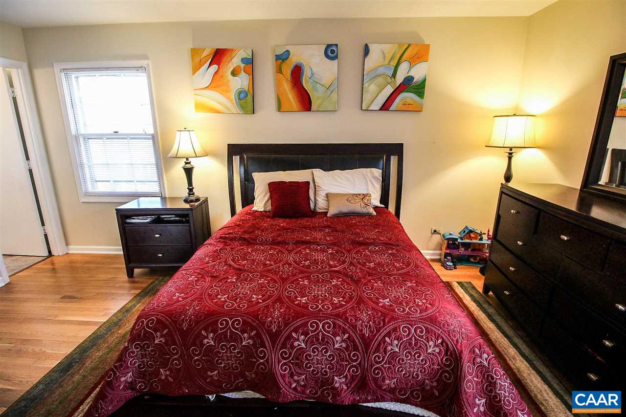 726 Shamrock Road Charlottesville, VA 22903 - Photo 23 of 27 a bed sitting in a bedroom next to a window