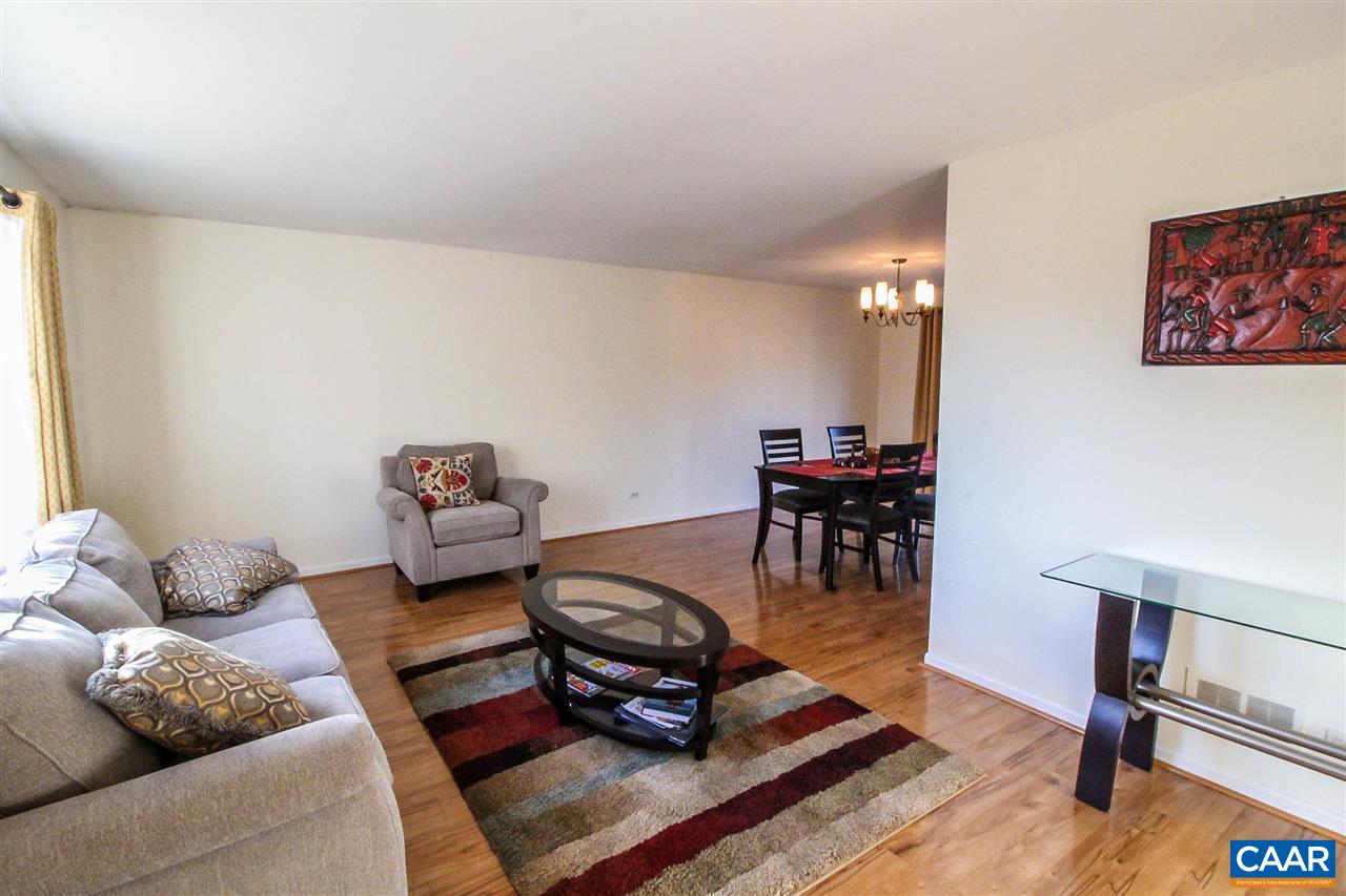 726 Shamrock Road Charlottesville, VA 22903 - Photo 5 of 27 a living room with furniture and a dining table