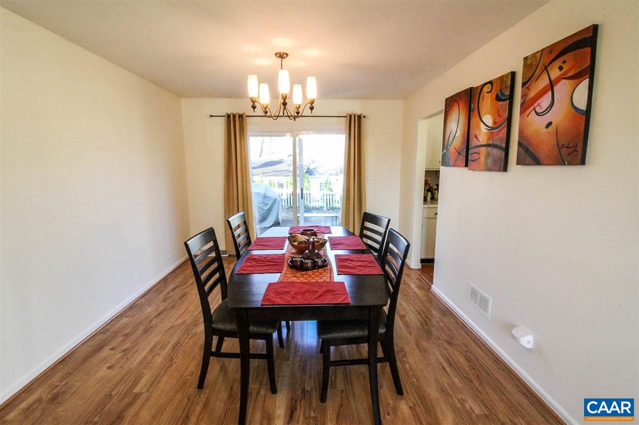 726 Shamrock Road Charlottesville, VA 22903 - Photo 7 of 27 a view of a dining room with furniture and chandelier