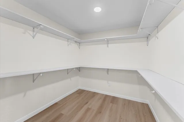 a view of an empty walk in closet
