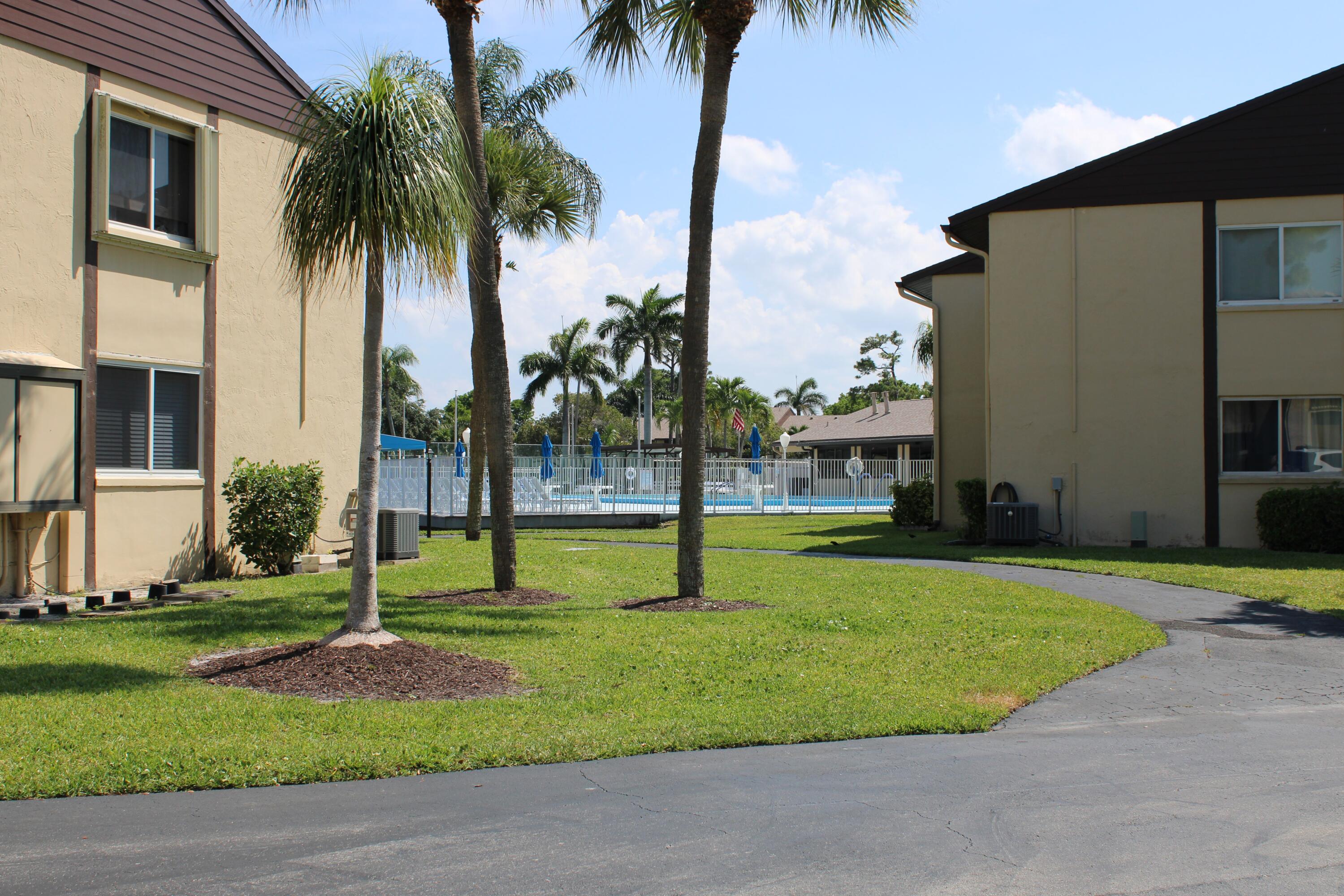 327 Pine Ridge Circle, Unit B2 Greenacres, FL 33463 - Photo 16 of 18 Pool from across street