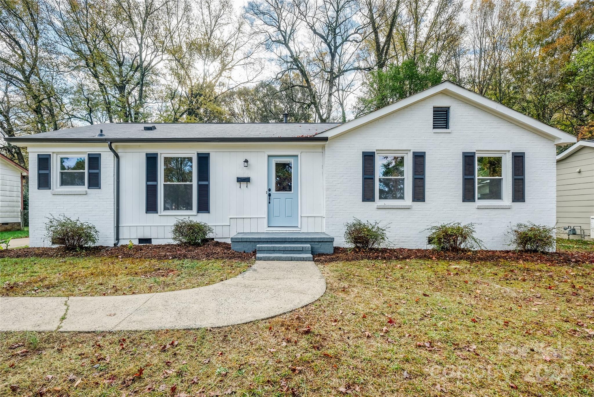 3728 Woodleaf Road Charlotte, NC 28205 - Photo 1 of 35 a view of a house with a yard