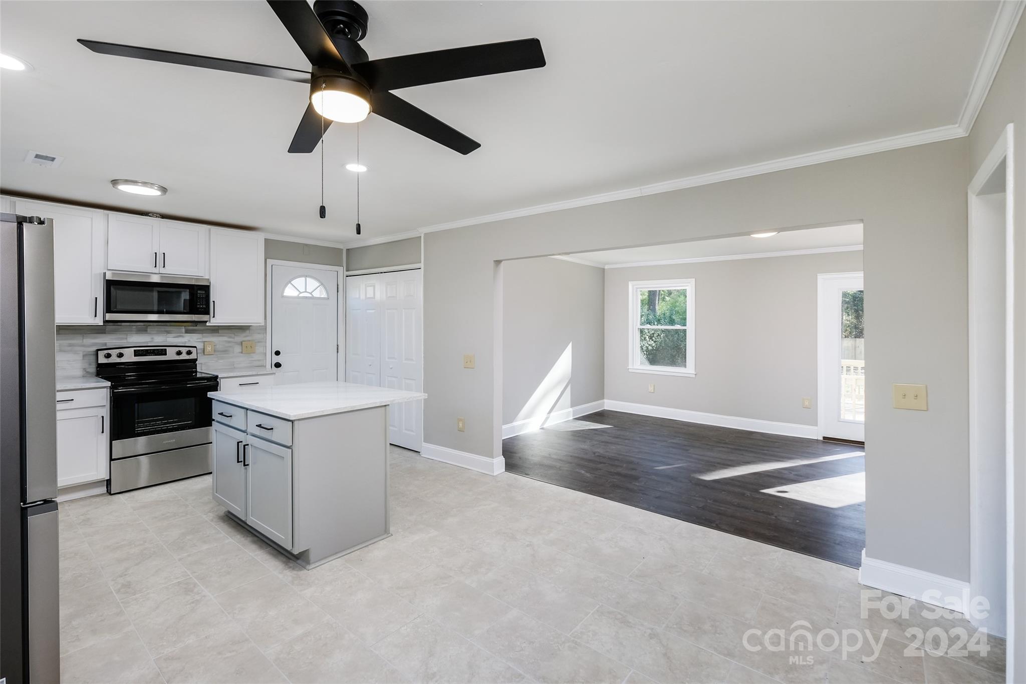 3728 Woodleaf Road Charlotte, NC 28205 - Photo 4 of 35 a view of a kitchen with a sink and microwave