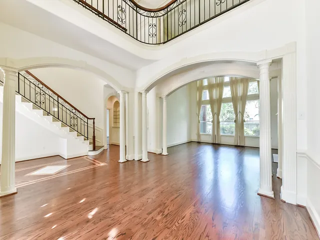 a view of an entryway with wooden floor