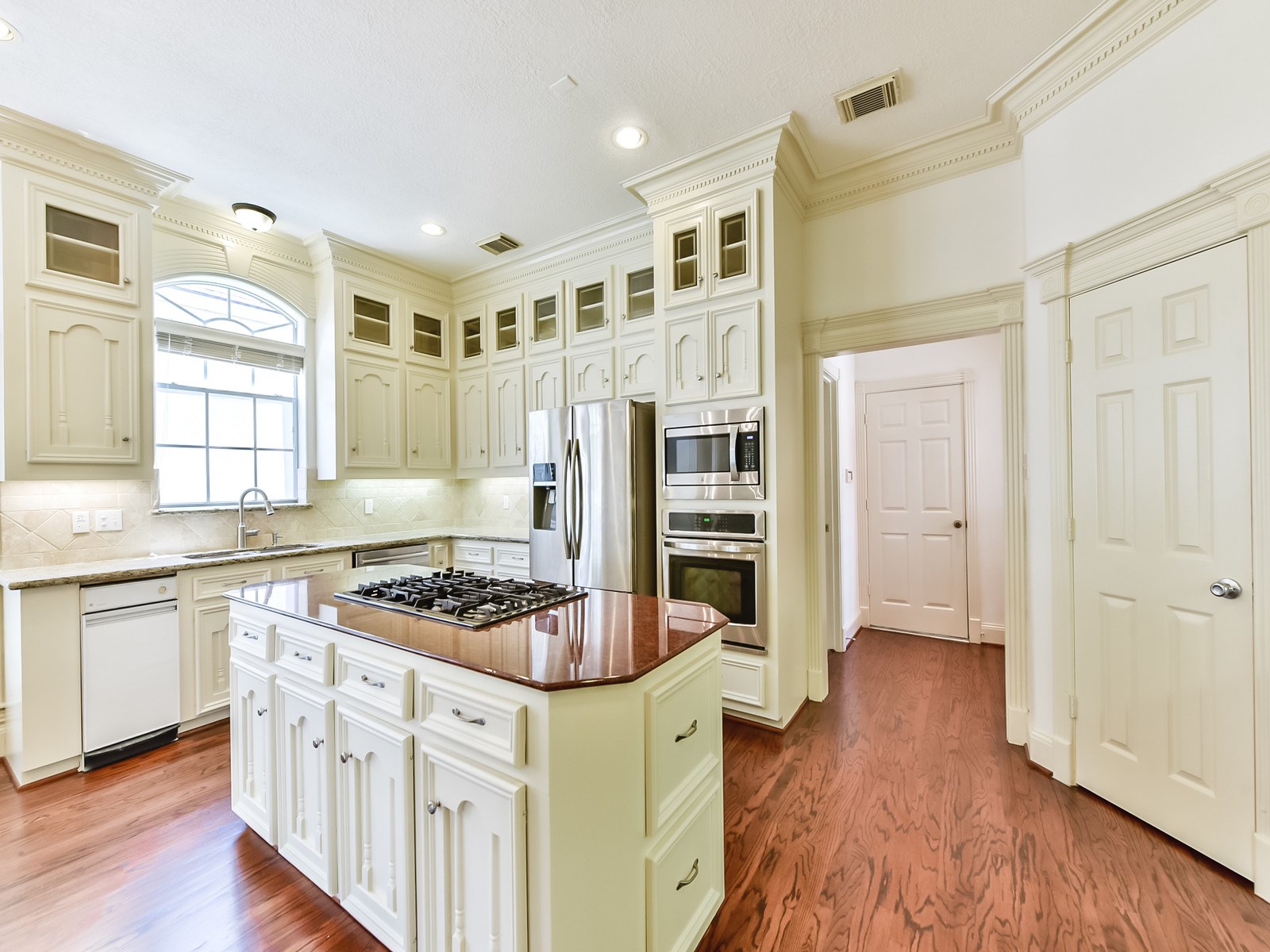 166 East Capstone Circle Spring, TX 77381 - Photo 14 of 45 a kitchen with stainless steel appliances granite countertop a stove and a refrigerator