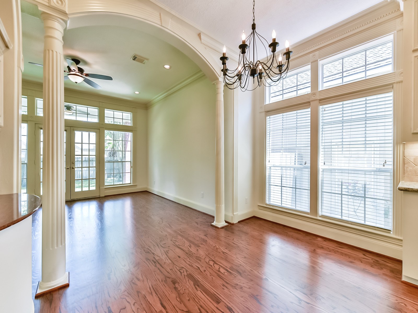 166 East Capstone Circle Spring, TX 77381 - Photo 20 of 45 a view of an empty room with wooden floor and a window