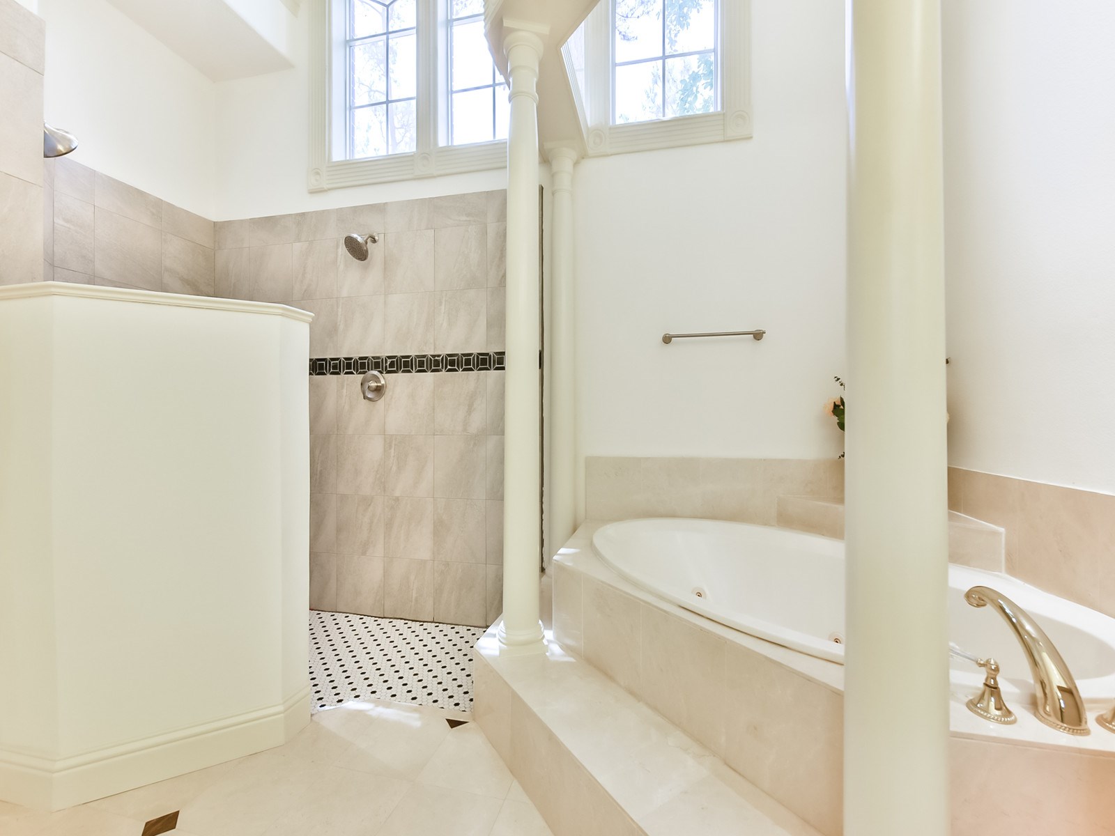 166 East Capstone Circle Spring, TX 77381 - Photo 27 of 45 a bathroom with a bathtub and a shower