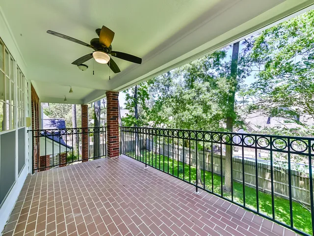 a view of outdoor space with wooden floor and windows
