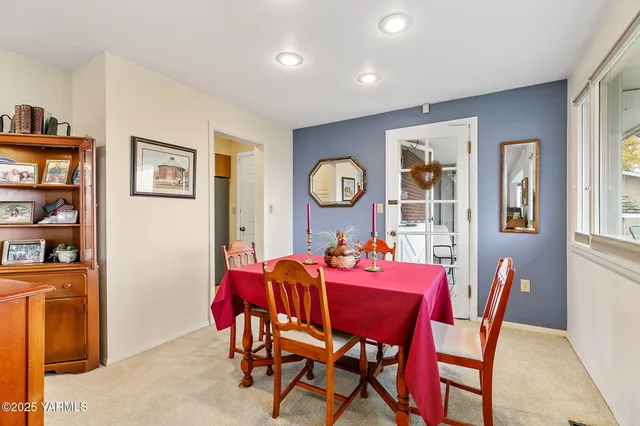 a dining room with furniture and window