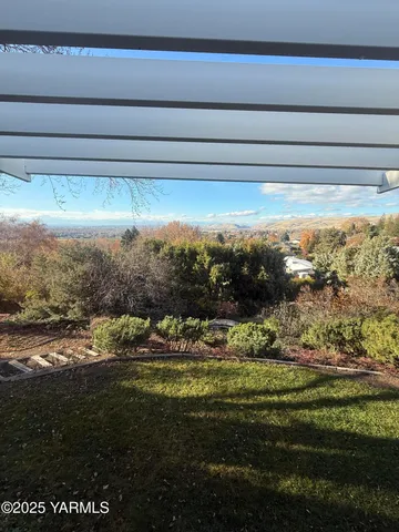 a view of water heater and covered with green space