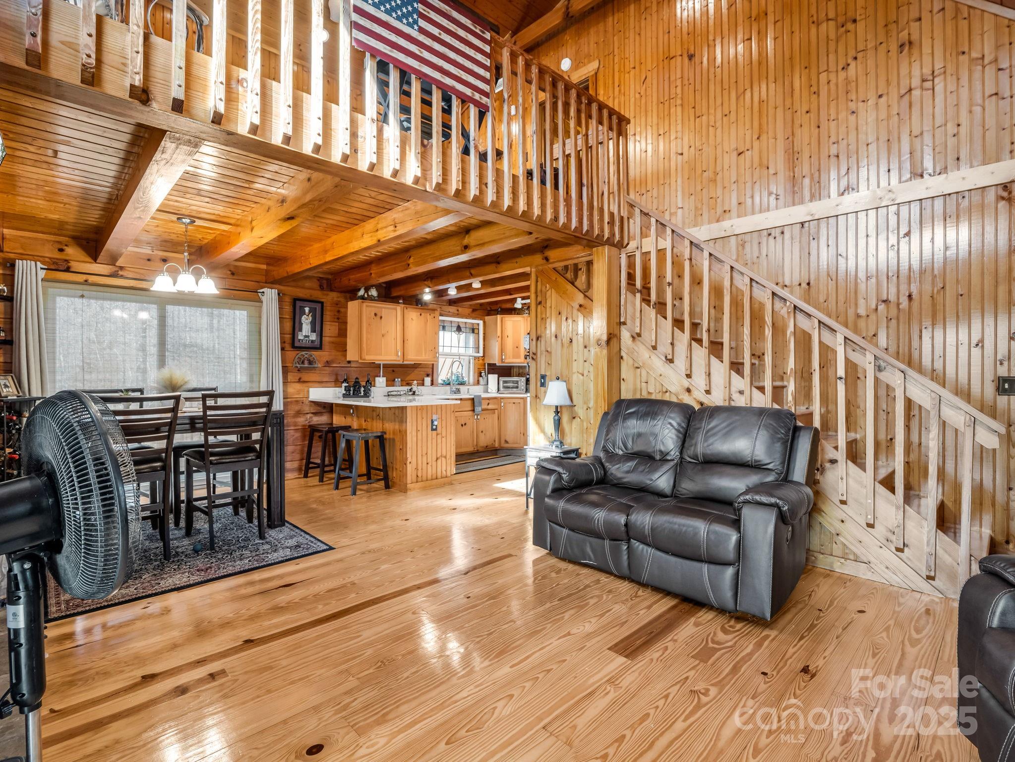 815 Cross Ridge Drive Rutherfordton, NC 28139 - Photo 18 of 34 a living room with furniture a ceiling fan and a rug