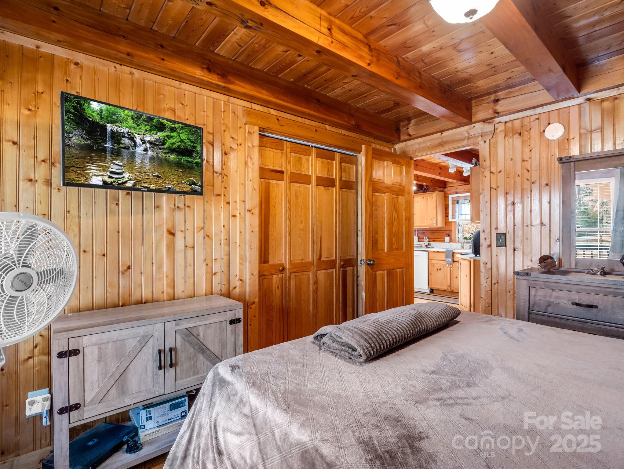 815 Cross Ridge Drive Rutherfordton, NC 28139 - Photo 27 of 34 a bedroom with a bed and a mirror