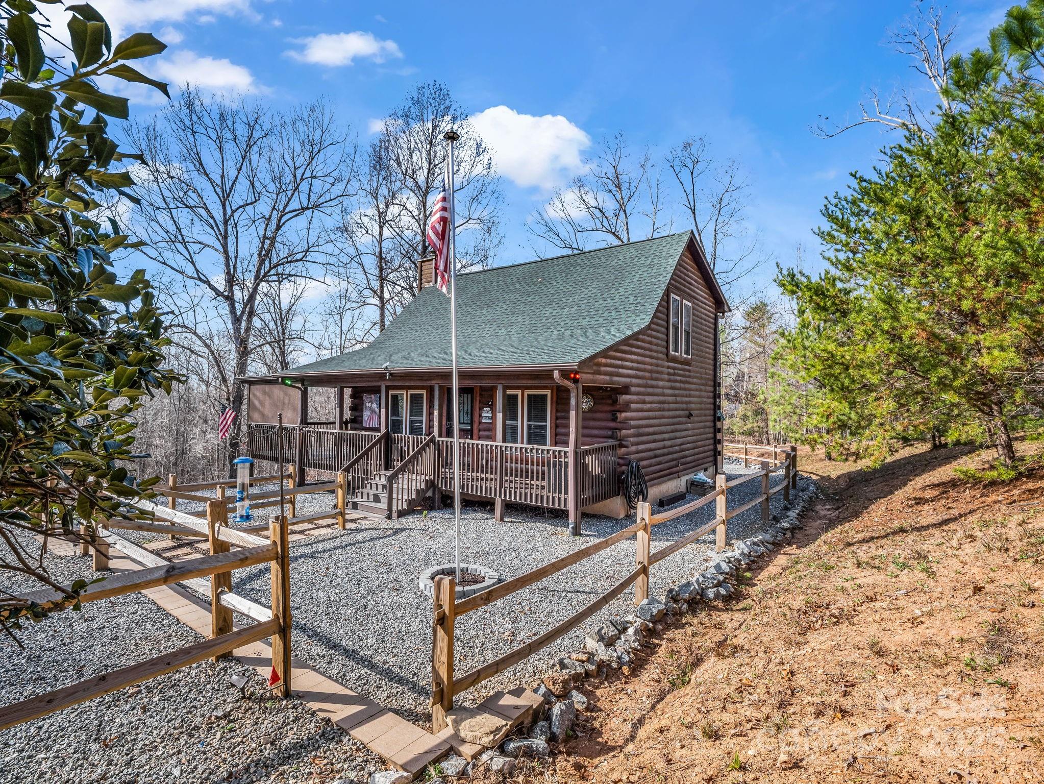 815 Cross Ridge Drive Rutherfordton, NC 28139 - Photo 5 of 34 a view of a roof deck with wooden fence and a bench