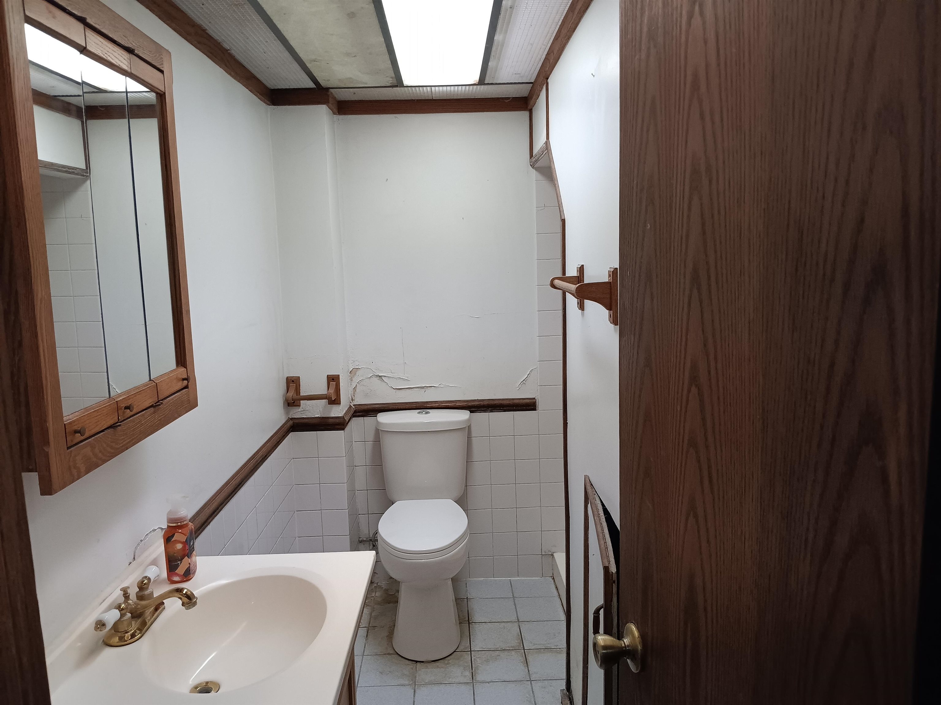1604 Parkside Court Freeport, IL 61032 - Photo 11 of 11 a bathroom with a toilet sink and mirror