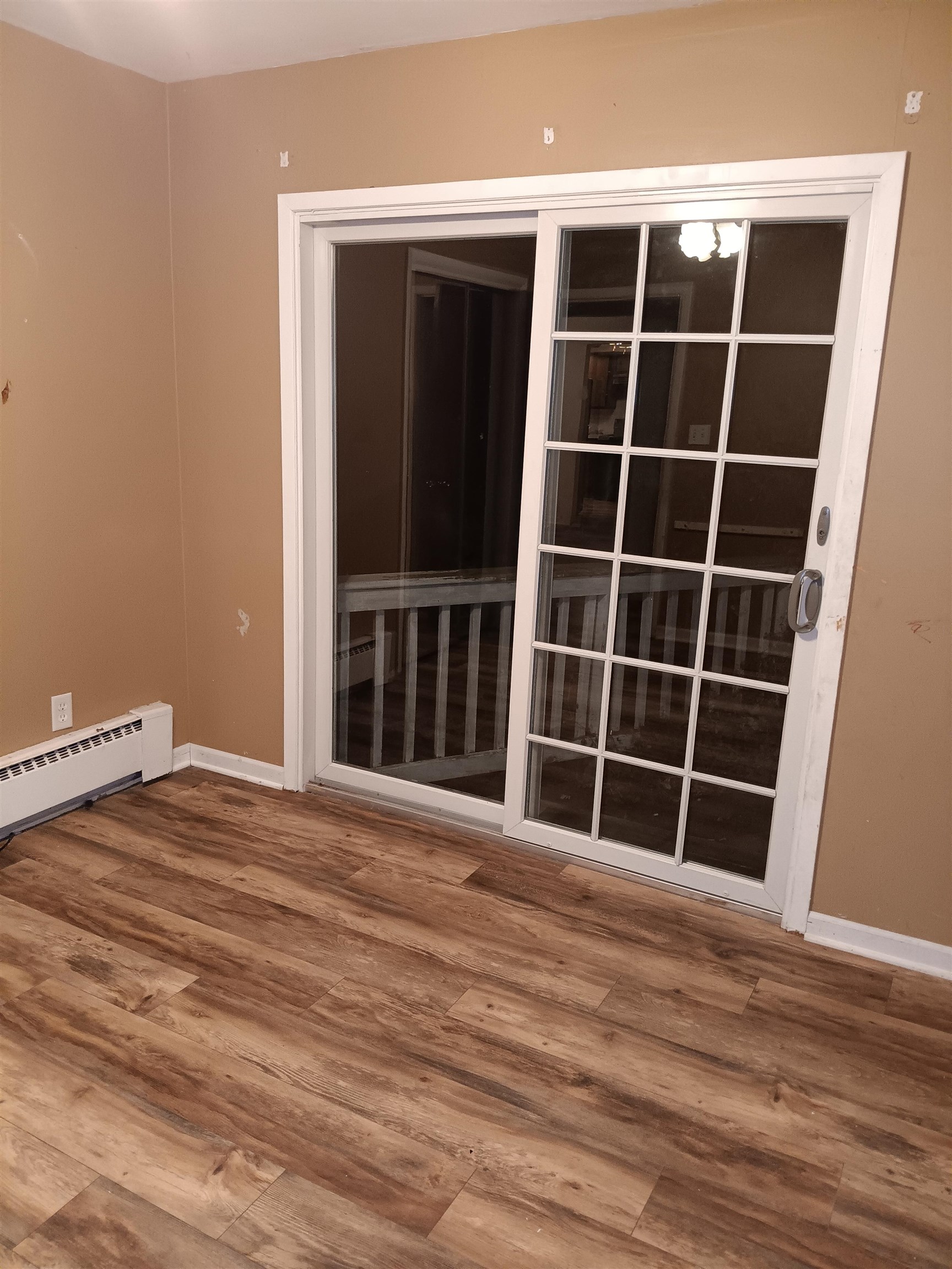 1604 Parkside Court Freeport, IL 61032 - Photo 7 of 11 a view of an empty room with wooden floor and a window