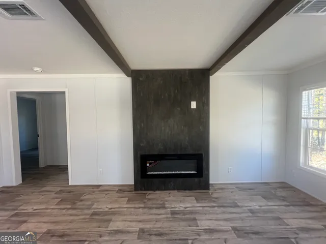 a view of entryway with wooden floor