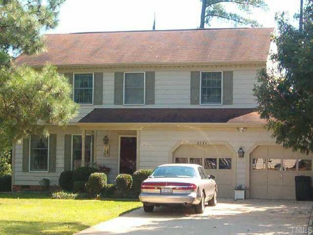 a car parked in front of a house