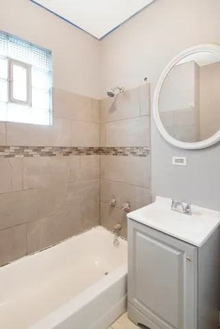 a bathroom with a sink a bathtub and a shower