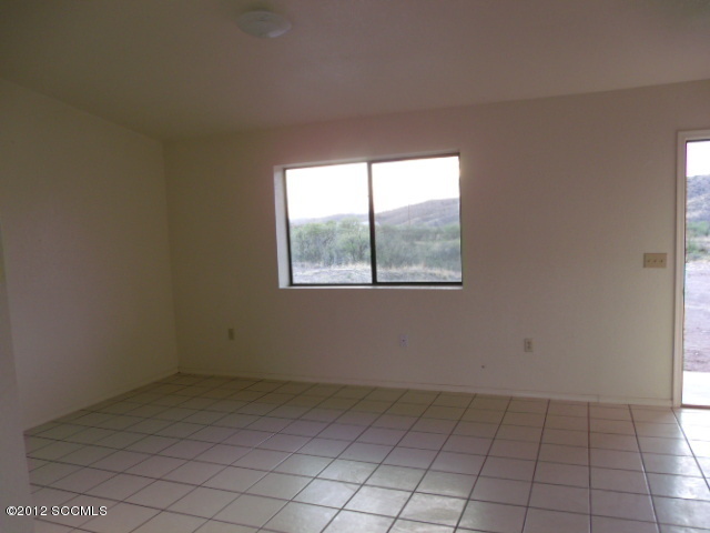 585 Yak Lane Rio Rico, AZ 85648 - Photo 3 of 11 an empty room with windows