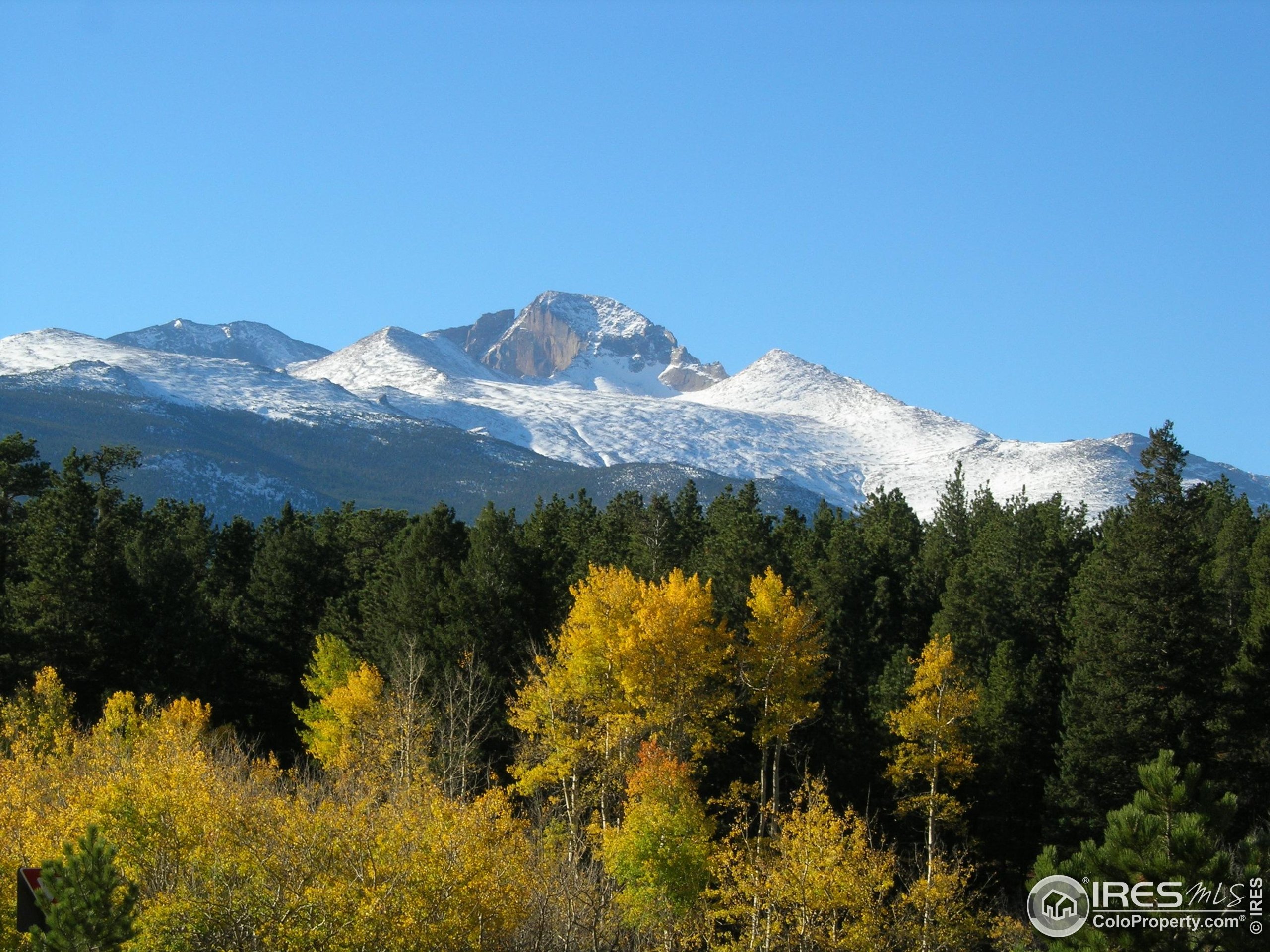 1565 Highway 66, Unit 49 Estes Park, CO 80517 - Photo 17 of 17 a view of a lake with mountains in the background