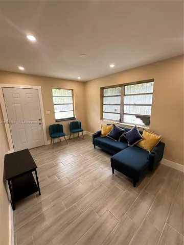 a living room with furniture and a window