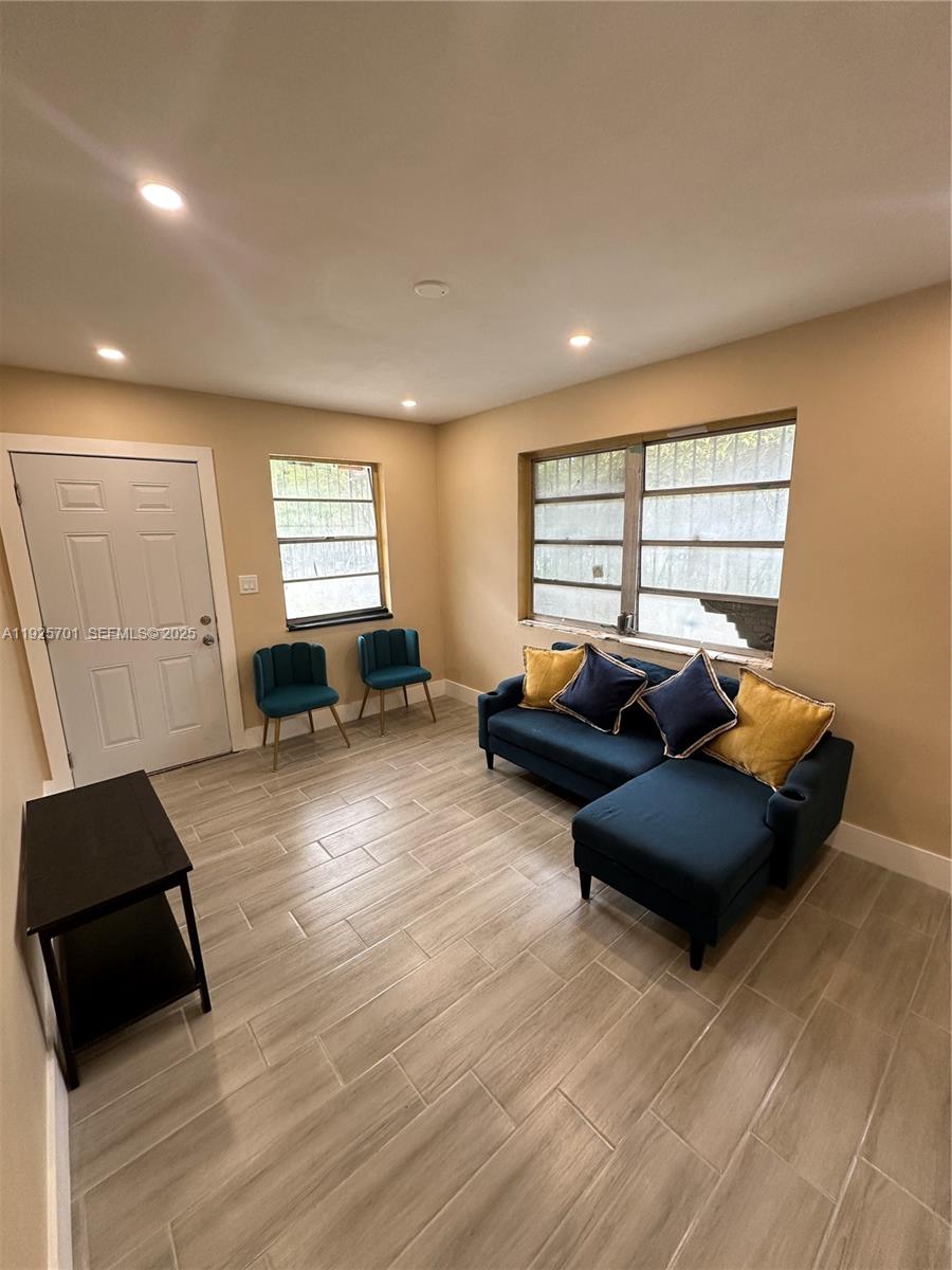 234 Northeast 55th Terrace Miami, FL 33137 - Photo 12 of 22 a living room with furniture and a window