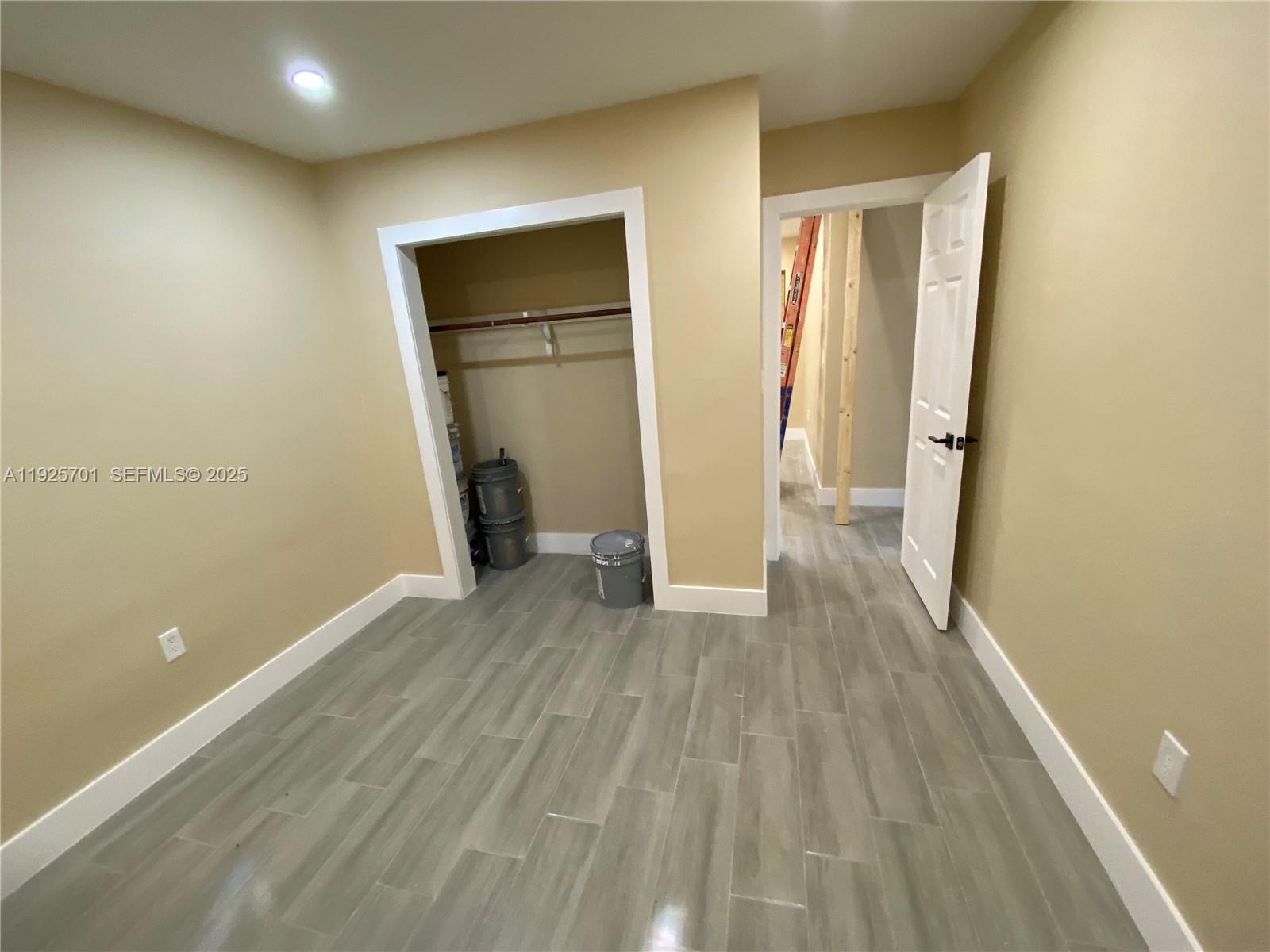 234 Northeast 55th Terrace Miami, FL 33137 - Photo 19 of 22 a view of empty room with wooden floor