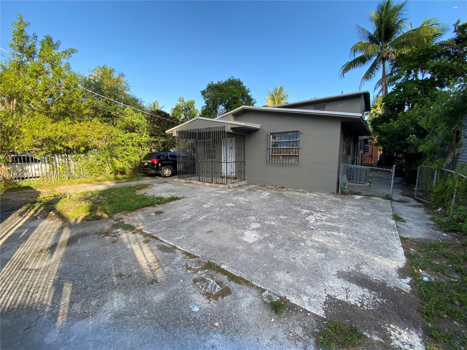 234 Northeast 55th Terrace Miami, FL 33137 - Photo 22 of 22 a view of a house with a yard