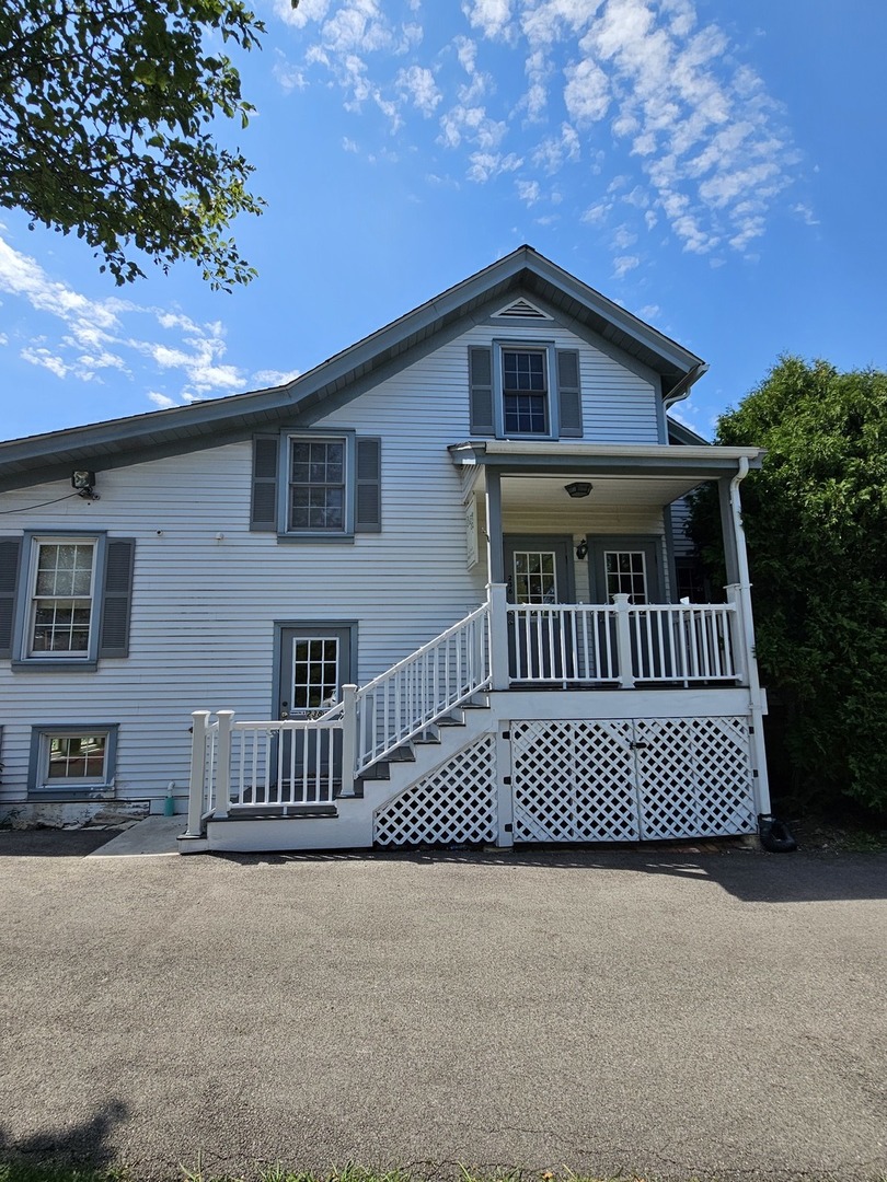 236 Robert Parker Coffin Road, Unit 236 Long Grove, IL 60047 - Photo 1 of 8 a view of a house with a deck
