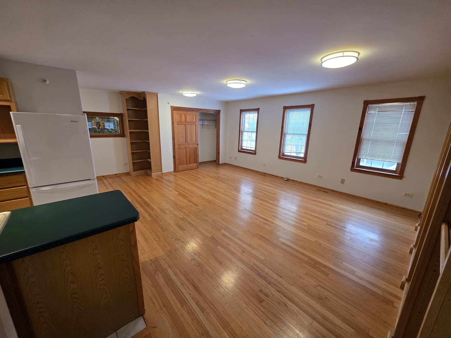236 Robert Parker Coffin Road, Unit 236 Long Grove, IL 60047 - Photo 2 of 8 a view of an empty room with window and wooden floor