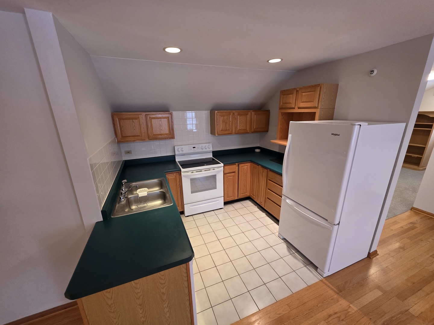 236 Robert Parker Coffin Road, Unit 236 Long Grove, IL 60047 - Photo 4 of 8 a kitchen with stainless steel appliances granite countertop a refrigerator stove and sink
