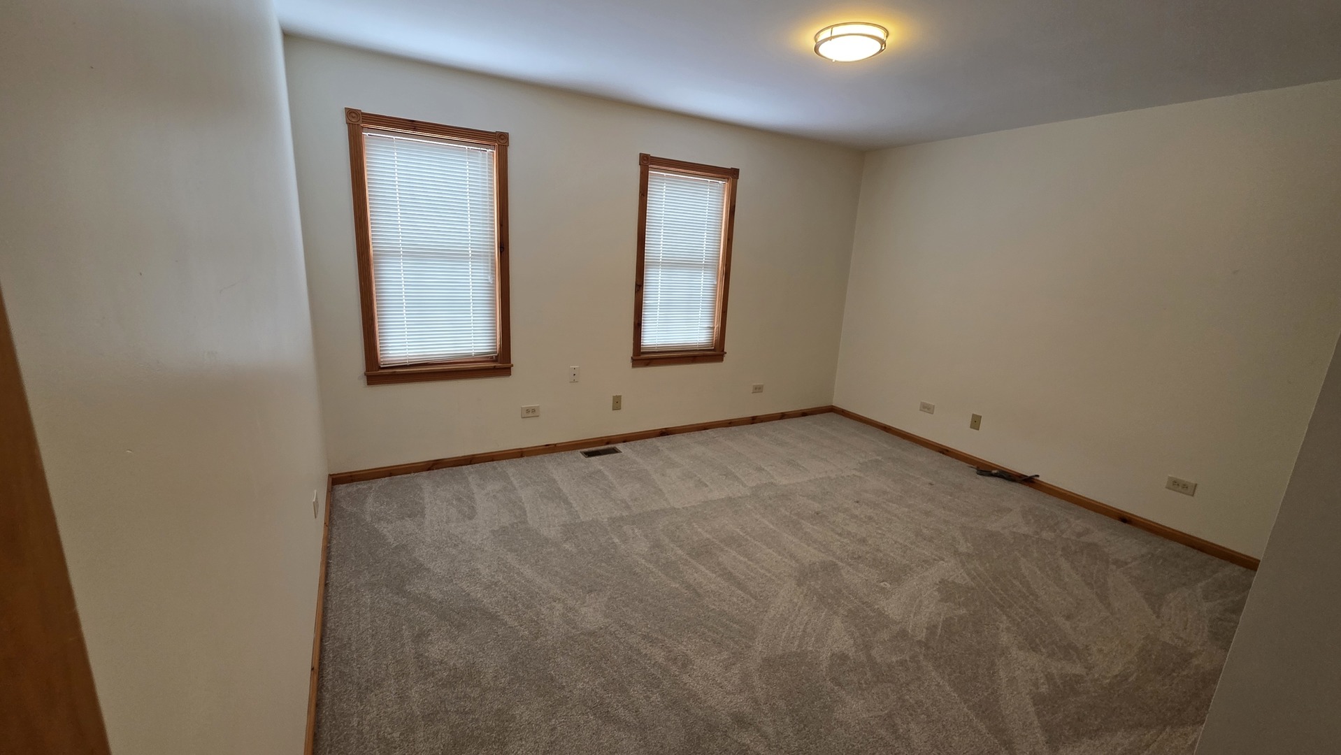 236 Robert Parker Coffin Road, Unit 236 Long Grove, IL 60047 - Photo 5 of 8 an empty room with windows and closet