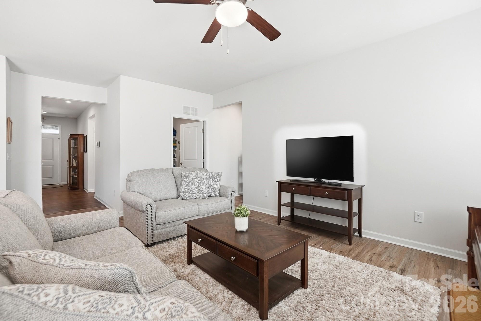 1842 Slippery Rock Lane Monroe, NC 28112 - Photo 11 of 25 a living room with furniture and a flat screen tv