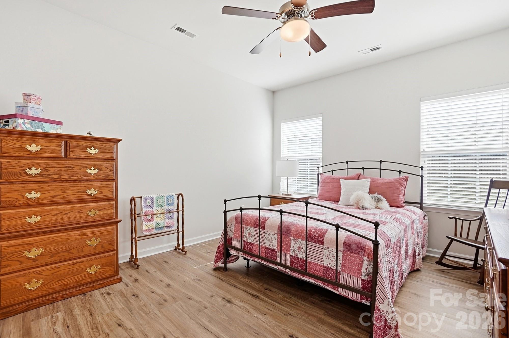1842 Slippery Rock Lane Monroe, NC 28112 - Photo 13 of 25 a bedroom with a bed and a chandelier