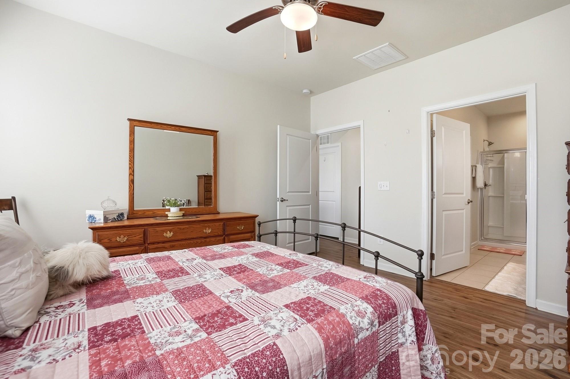 1842 Slippery Rock Lane Monroe, NC 28112 - Photo 14 of 25 a bedroom with a bed and a mirror