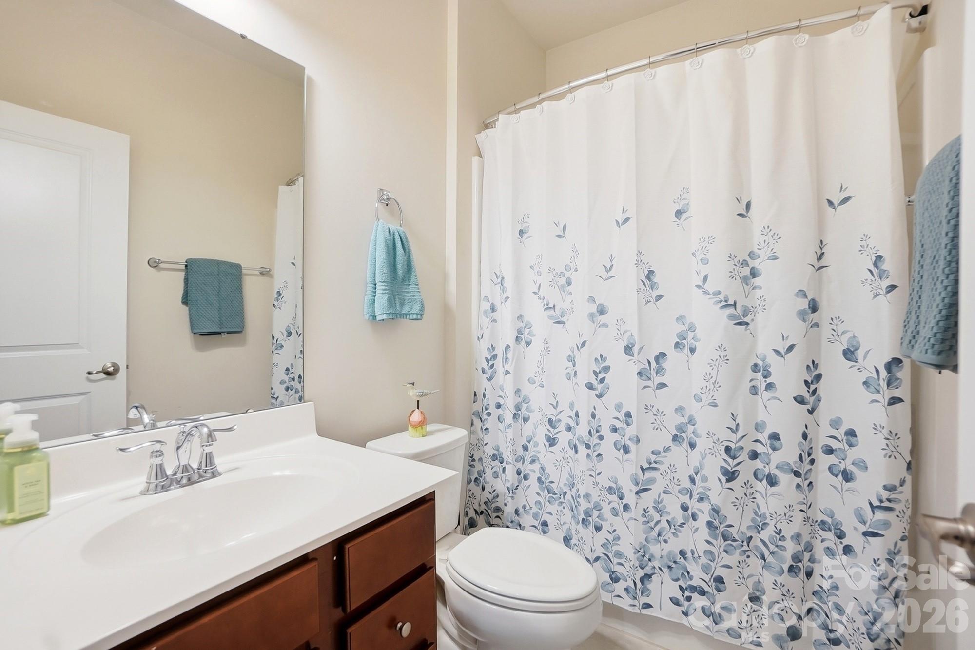 1842 Slippery Rock Lane Monroe, NC 28112 - Photo 17 of 25 a bathroom with a sink toilet and mirror