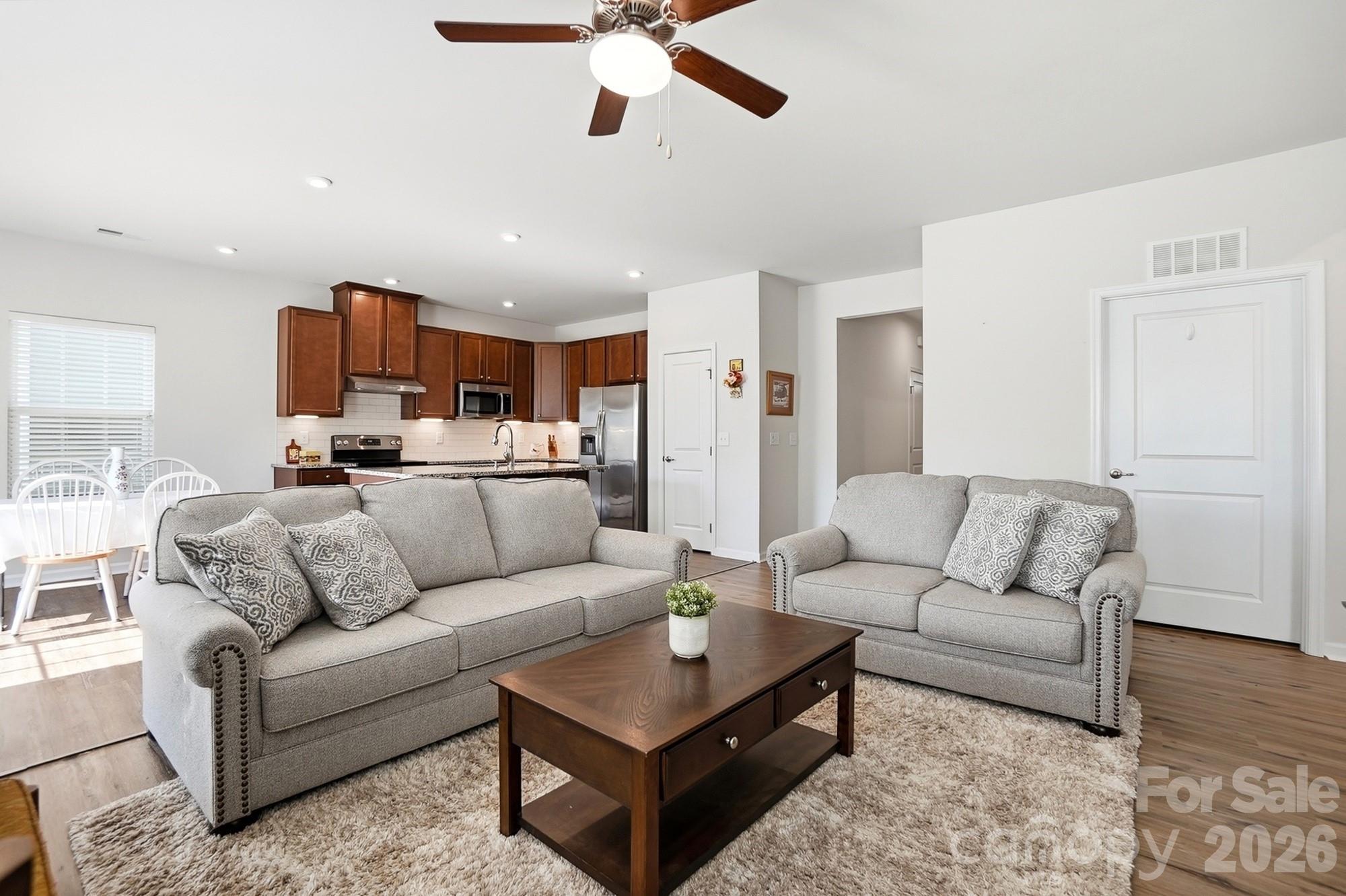1842 Slippery Rock Lane Monroe, NC 28112 - Photo 9 of 25 a living room with furniture and a ceiling fan