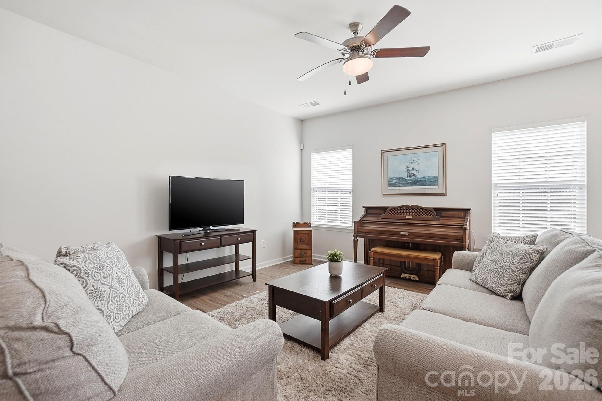 1842 Slippery Rock Lane Monroe, NC 28112 - Photo 10 of 25 a living room with furniture and a flat screen tv