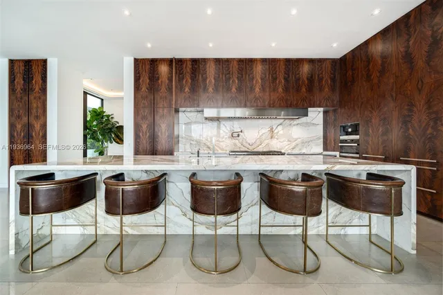 a large white kitchen with a large window