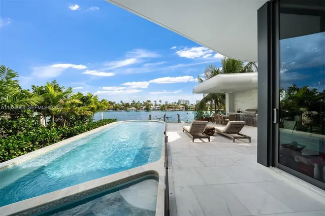 a spacious bedroom with a large bed and a large window