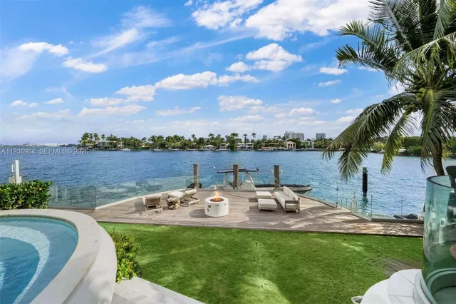 a spacious bedroom with a bed and a view of living room