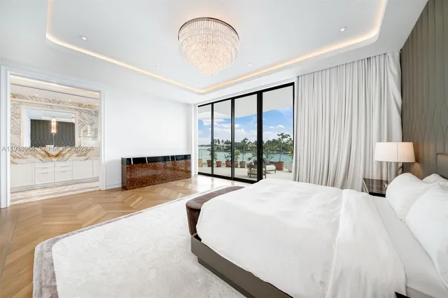 a living room filled with furniture and a floor to ceiling window