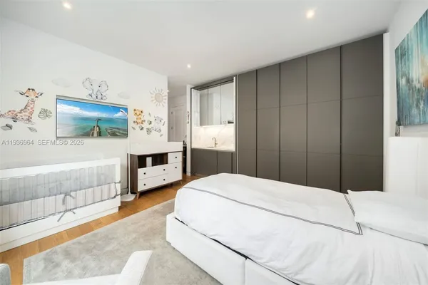 a bedroom with furniture and a window