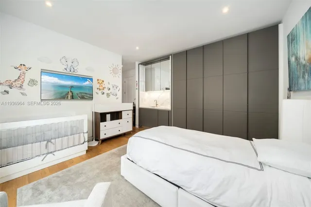 a bedroom with furniture and a window